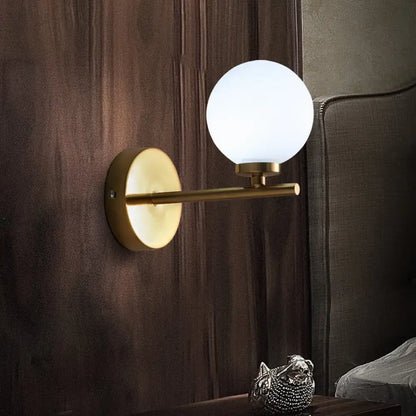 Gold opal glass wall light by Decorbites with brass mount and single globe on Tampa Home & Garden Store