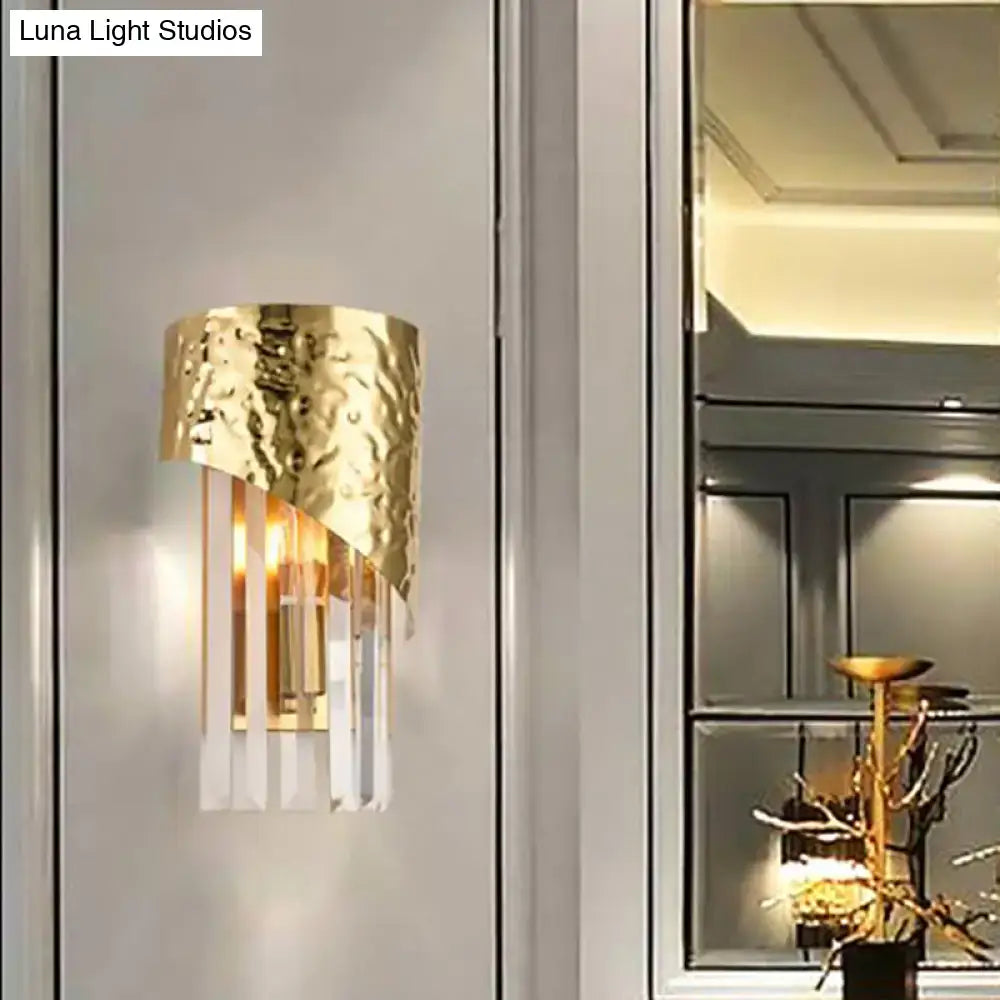 Gold hammered metal sconce with hanging crystal prisms and LED lighting on Tampa Home & Garden Store