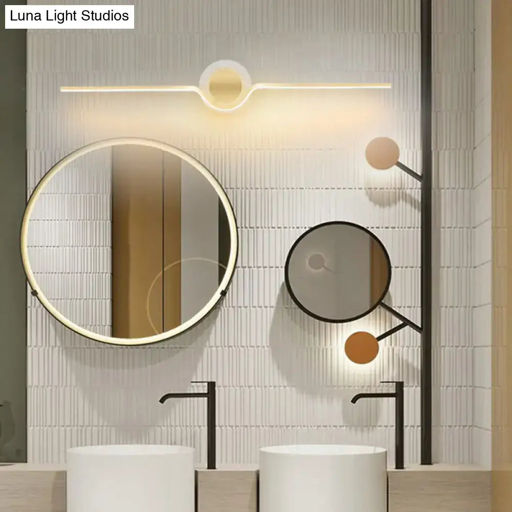 Modern gold linear LED wall sconce bathroom light beside round mirrors Luna Light Studios on Tampa Home & Garden Store