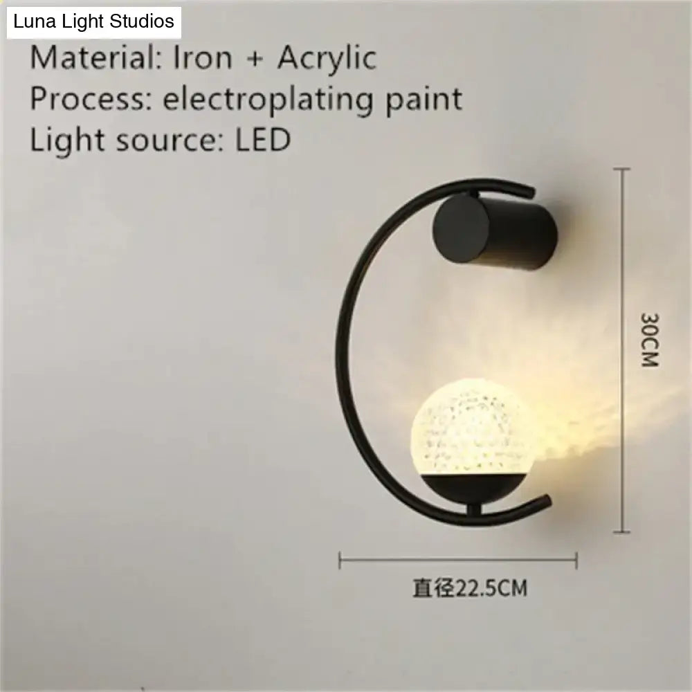Black iron crescent wall light with frosted glass globe, LED bedroom sconce on Tampa Home & Garden Store