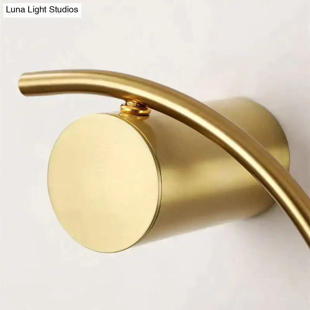 Gold LED bedside wall light with curved arm and round backplate, Luna Light Studios watermark on Tampa Home & Garden Store