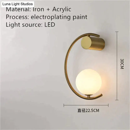 Gold crescent-frame wall light with frosted glass orb LED bedside sconce 30cm tall on Tampa Home & Garden Store