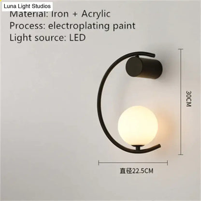 Modern LED bedside wall light sconce by Decorbites with black ring and glowing orb on Tampa Home & Garden Store