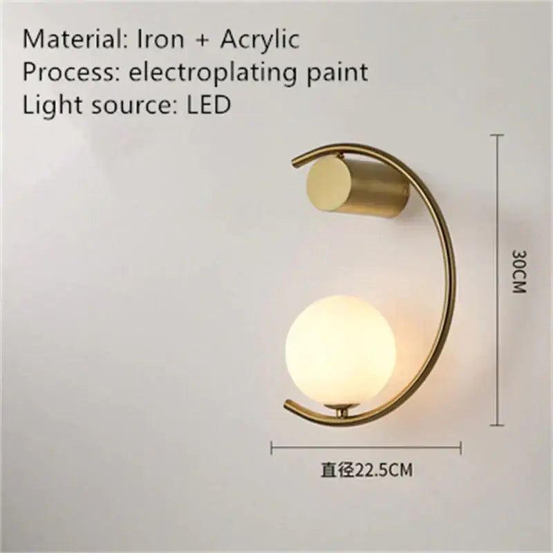 Bedside wall light with curved gold arc and frosted glass globe, LED bulb on Tampa Home & Garden Store