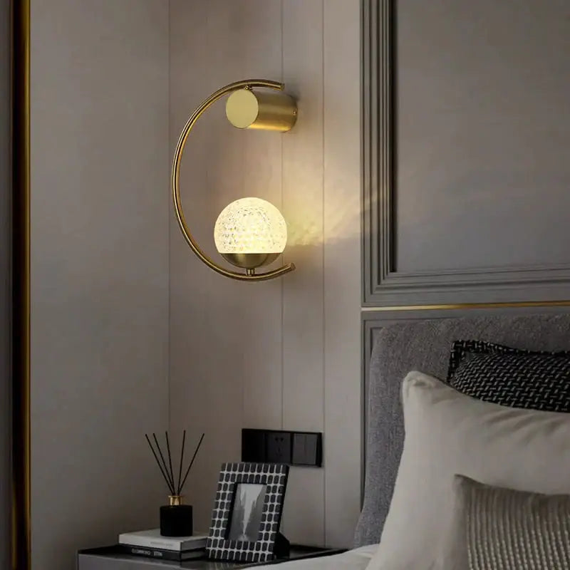 Gold LED bedside wall sconce with circular arc and glass globe Decorbites Tampa Garden on Tampa Home & Garden Store