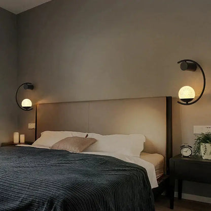 Bedside wall light by Decorbites, modern gold LED with curved arc and frosted globe, two sconces on Tampa Home & Garden Store