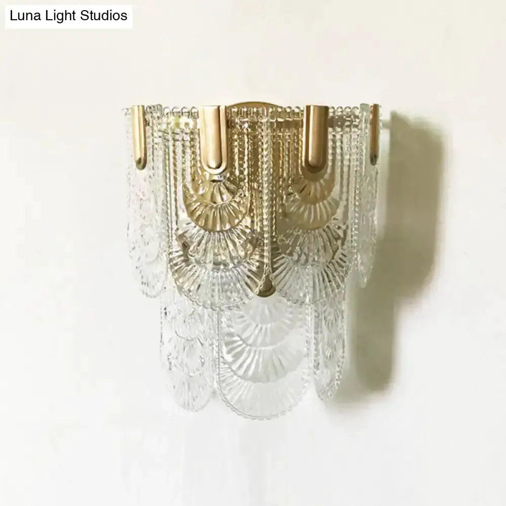 Decorbites modern gold wall sconce with crystal scalloped fringe on Tampa Home & Garden Store