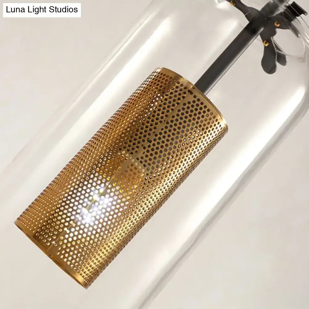 Gold mesh glass sconce with perforated cylindrical shade by Decorbites on Tampa Home & Garden Store