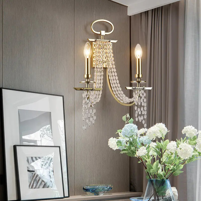 Gold Crystal Candle Sconce with dual bulbs and hanging crystal strands Decorbites on Tampa Home & Garden Store