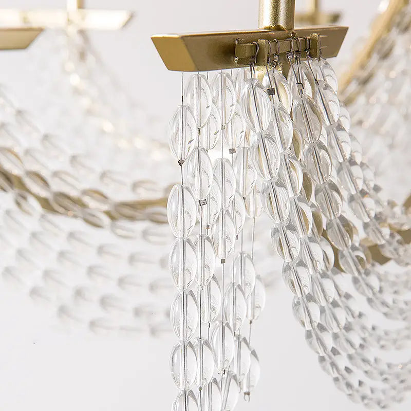 Gold crystal candle sconce by Decorbites with hanging faceted glass discs on Tampa Home & Garden Store