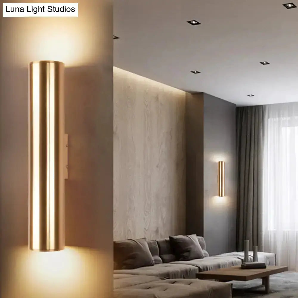 Two vertical gold metal wall lamp fixtures with tubular glow for a modern corridor on Tampa Home & Garden Store