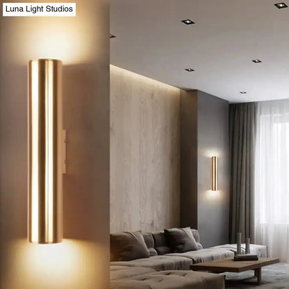 Two vertical gold metal wall lamp fixtures with tubular glow for a modern corridor on Tampa Home & Garden Store