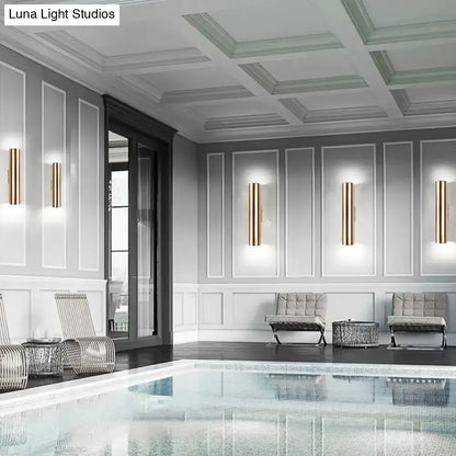 Modern gold metal wall lamp for corridor with vertical bar design on Tampa Home & Garden Store