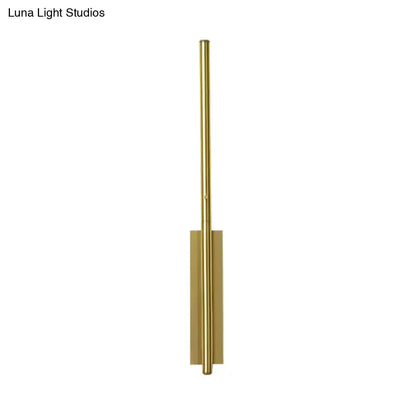 Gold linear reading nook sconce with a tall vertical rod and rectangular backplate on Tampa Home & Garden Store