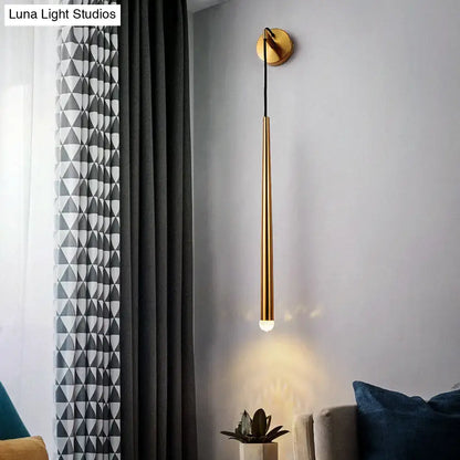 Gold tapered shade sconce by Decorbites, wall-mounted with black cord and gold backplate on Tampa Home & Garden Store