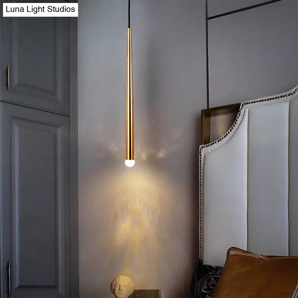 Gold tapered shade sconce by Decorbites, slim brass cylinder emits warm bedside glow on Tampa Home & Garden Store