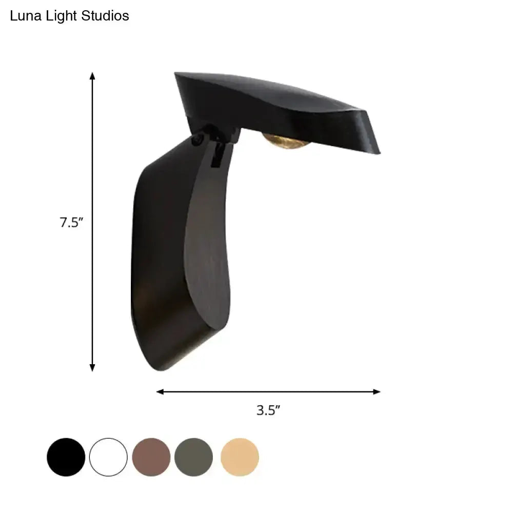 Black metal wall sconce with curved backplate and top shade, 7.5in tall on Tampa Home & Garden Store