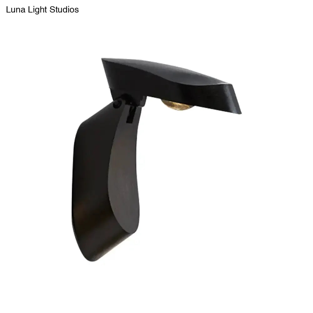 Wall light sconce by Decorbites, black metal with curved backplate and top shade, bulb shown on Tampa Home & Garden Store