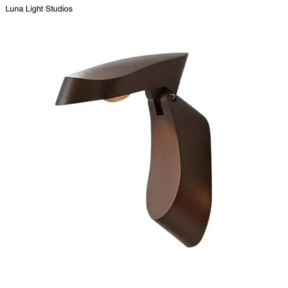 Modern gold metal wall light bedside fixture by Decorbites, curved sculptural sconce on Tampa Home & Garden Store