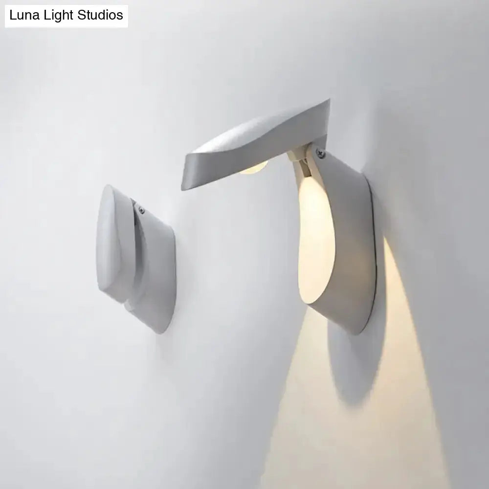 Modern gold metal wall light bedside fixture by Decorbites with curved arm on Tampa Home & Garden Store