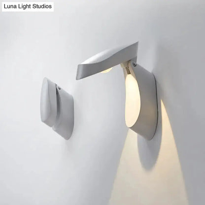 Modern gold metal wall light bedside fixture by Decorbites with curved arm on Tampa Home & Garden Store
