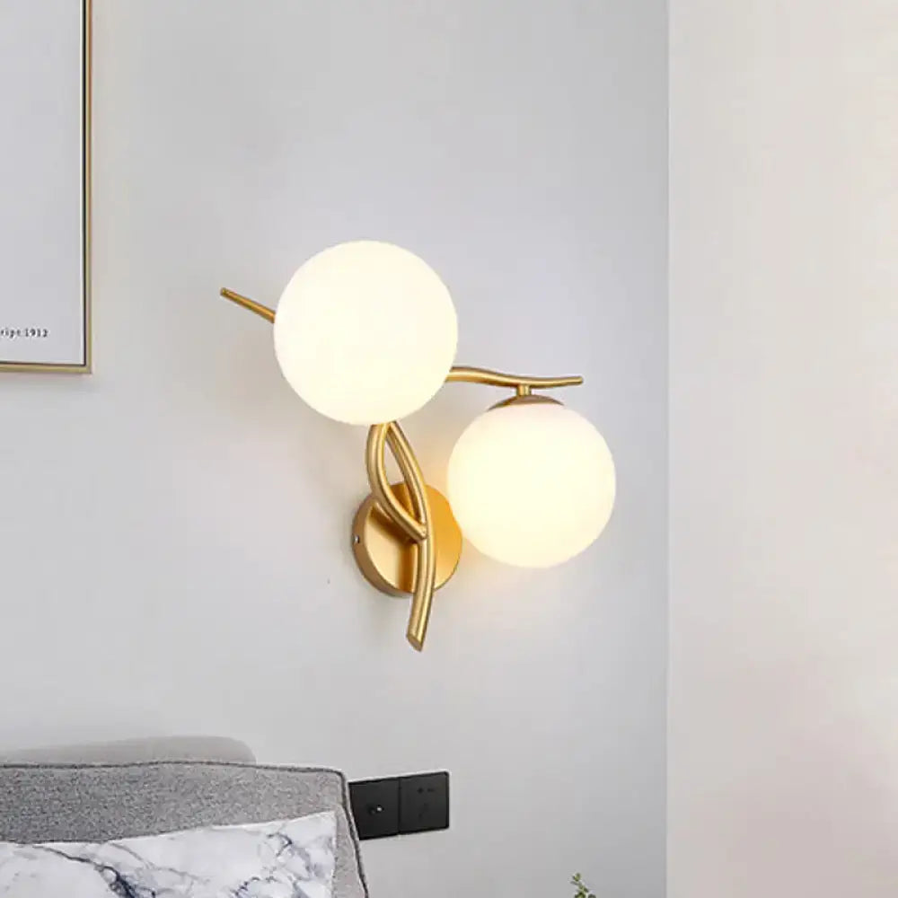 Gold orb wall sconce with twin frosted glass globes on brass mount Decorbites on Tampa Home & Garden Store