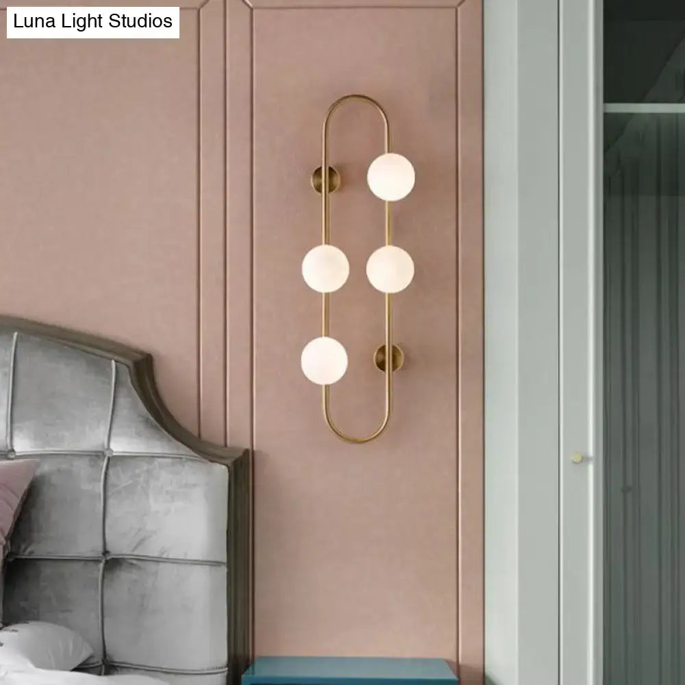 Gold Milky Glass Sconce with four globes and slim gold frame on Tampa Home & Garden Store