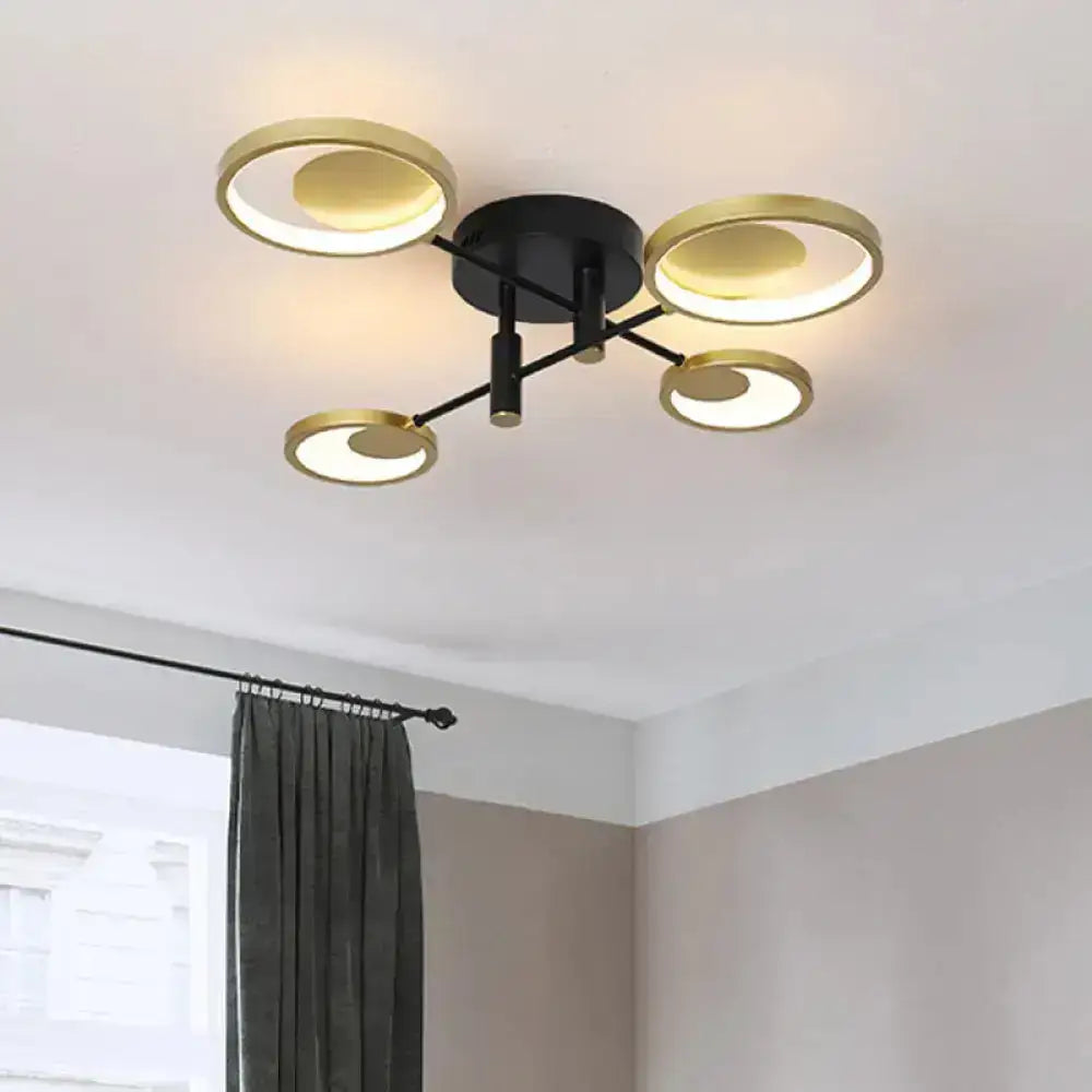 Gold Molecule Ceiling Chandelier with 4 circular gold rings around a black hub Decorbites on Tampa Home & Garden Store