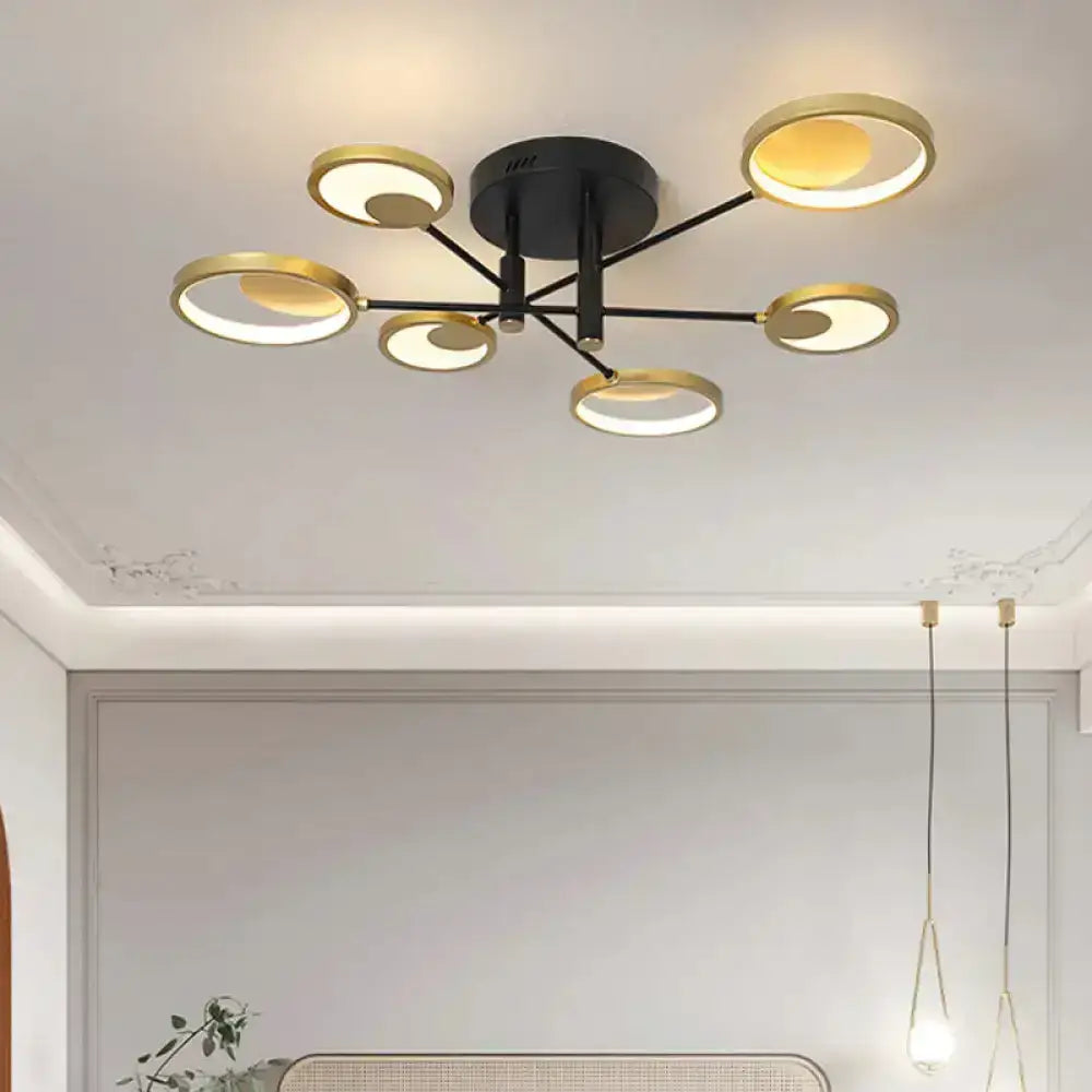 Gold molecule ceiling chandelier by Decorbites with circular rings and black mount on Tampa Home & Garden Store