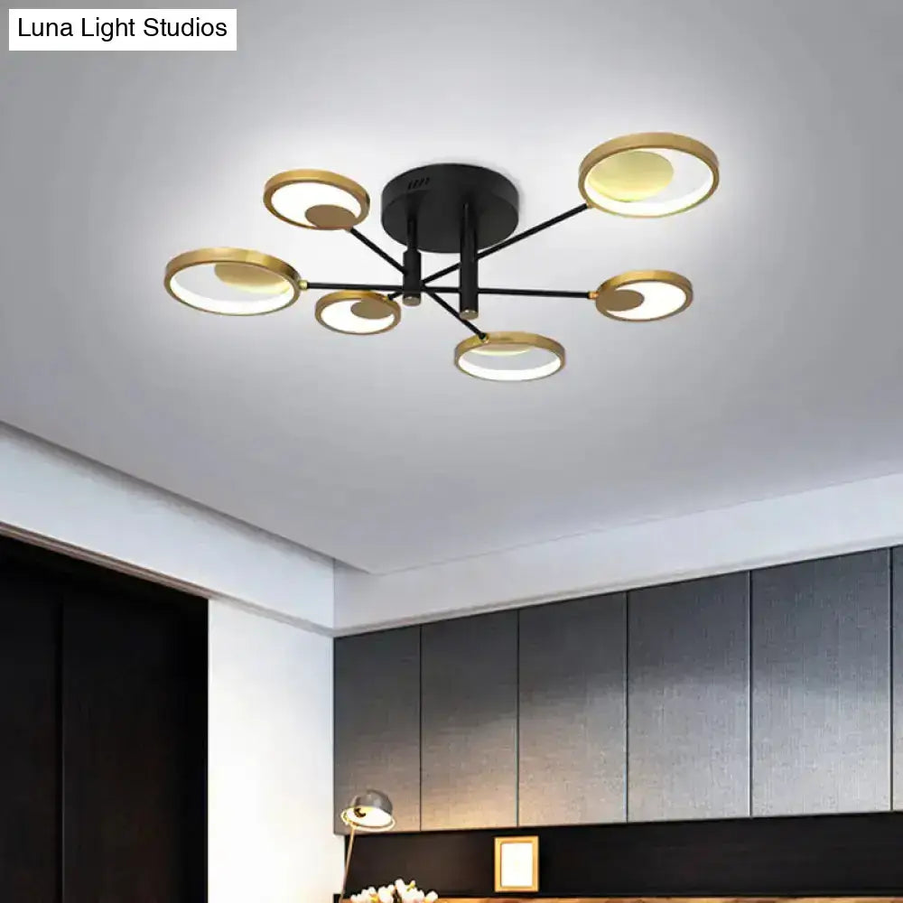 Gold Molecule Ceiling Chandelier with black metal arms and gold circular rings on Tampa Home & Garden Store