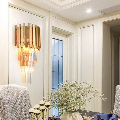 Gold crystal prism wall light with vertical bars and hanging prisms by Decorbites for dining on Tampa Home & Garden Store