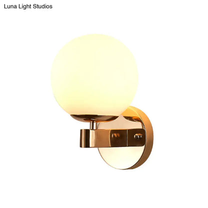 Gold Opal Glass Sconce with round frosted globe and brass wall mount Decorbites on Tampa Home & Garden Store
