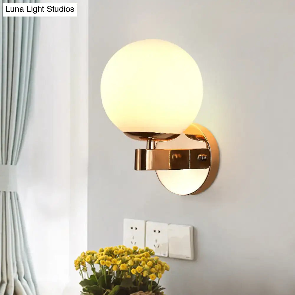Gold Opal Glass Sconce by Decorbites, brass wall light with round globe shade on Tampa Home & Garden Store
