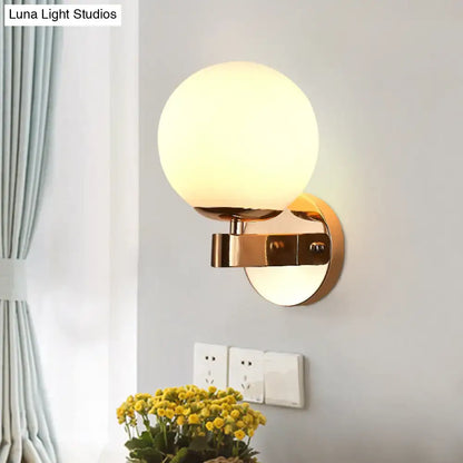 Gold Opal Glass Sconce by Decorbites, brass wall light with round globe shade on Tampa Home & Garden Store