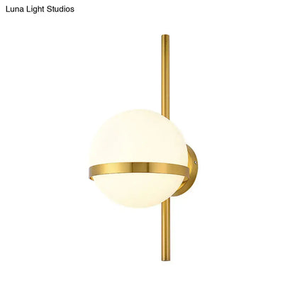 Gold opal glass wall sconce by Decorbites with a gold rod and circular wall mount on Tampa Home & Garden Store
