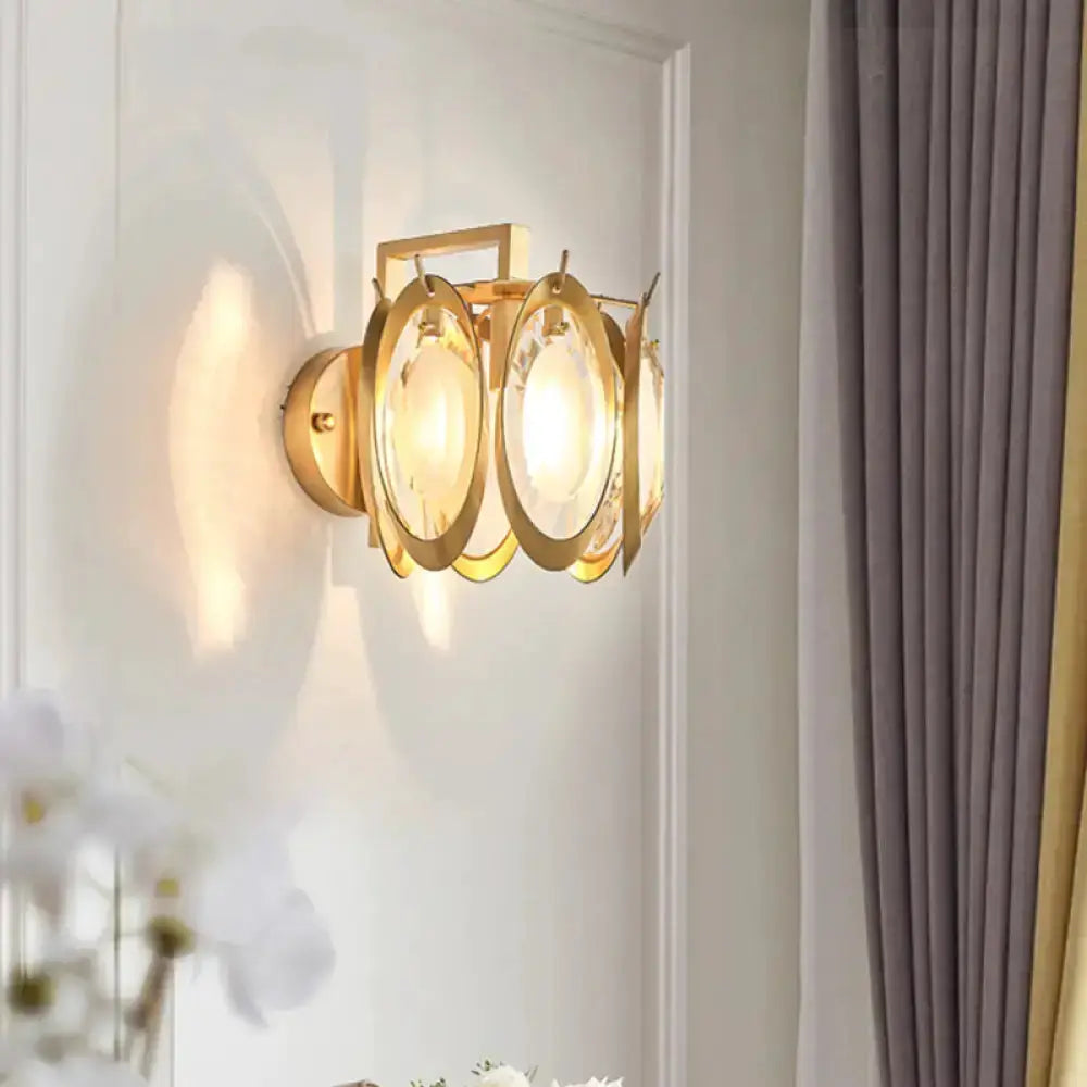 Modern gold oval crystal wall light by Decorbites, gold metal frame with crystal rings on Tampa Home & Garden Store