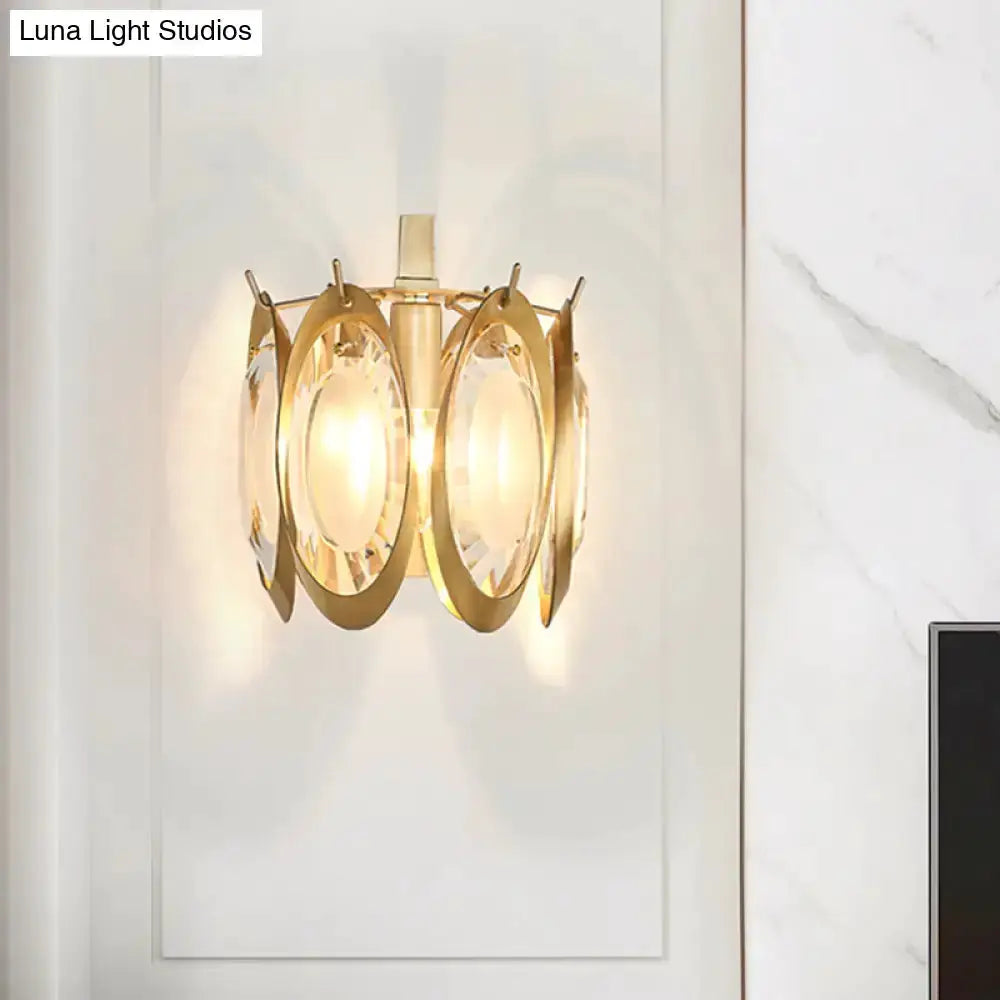 Modern gold oval crystal wall light fixture with circular crystal panels on Tampa Home & Garden Store