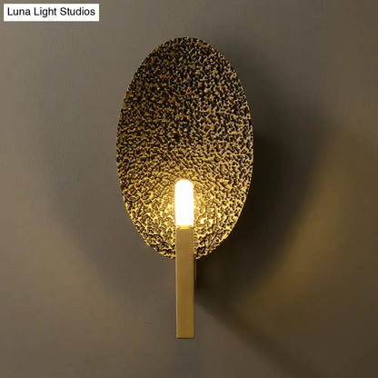 Gold metal speckled glass sconce by Decorbites, oval wall light with brass stem on Tampa Home & Garden Store