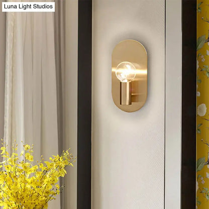 Decorbites gold metal bare bulb sconce with oval backplate and single exposed bulb on Tampa Home & Garden Store