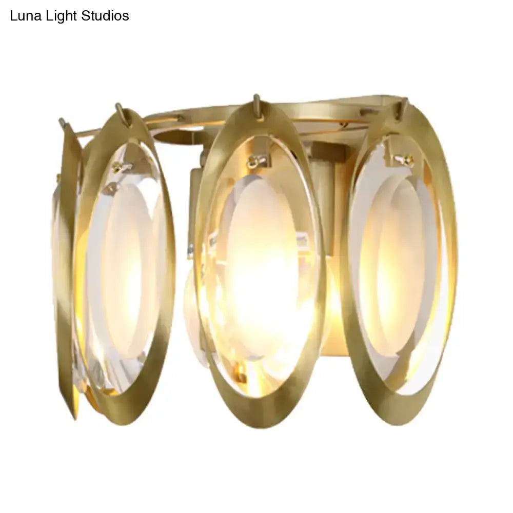 Modern gold oval sconce light with glass panels, triple-ring wall fixture on Tampa Home & Garden Store