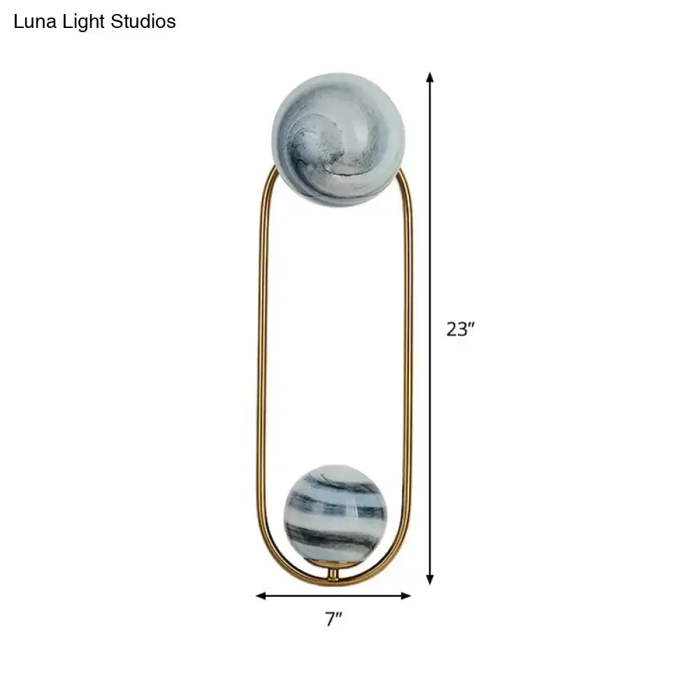 Decorbites modern gold oval wall sconce with two marble shades for living room lighting on Tampa Home & Garden Store