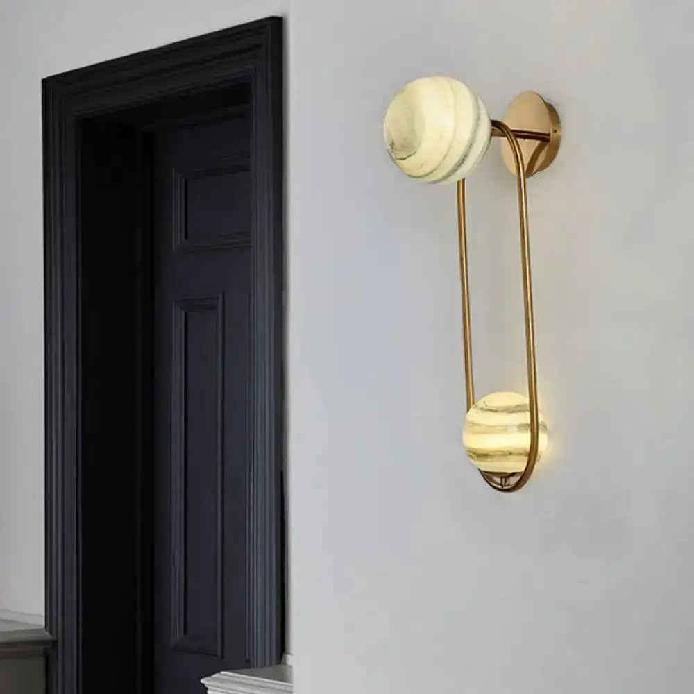 Modern gold oval wall sconce with two marble globe shades for living room Decorbites on Tampa Home & Garden Store