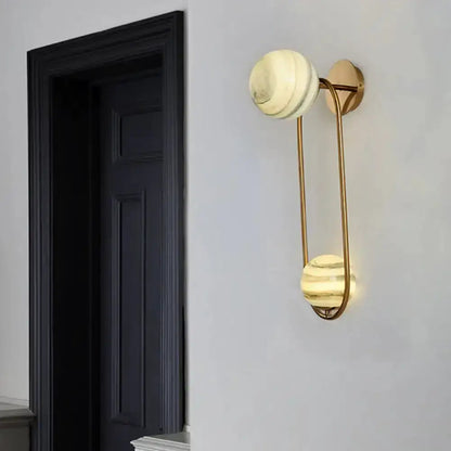 Modern gold oval wall sconce with two marble globe shades for living room Decorbites on Tampa Home & Garden Store