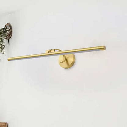Gold pipe vanity light by Decorbites with brass finish and wall-mount round backplate on Tampa Home & Garden Store