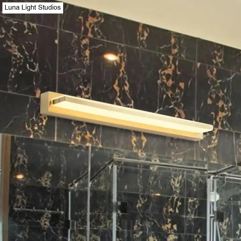 Gold LED wall sconce with rectangular acrylic shade mounted on black marble wall on Tampa Home & Garden Store