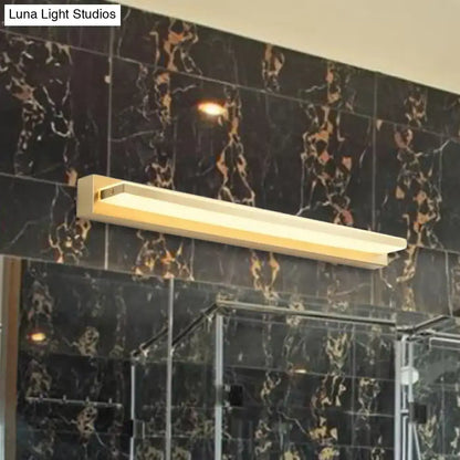 Gold LED wall sconce with rectangular acrylic shade mounted on black marble wall on Tampa Home & Garden Store
