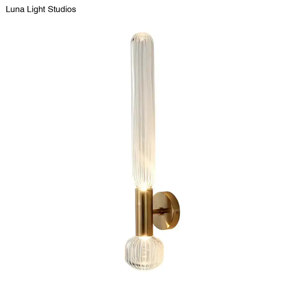 Modern gold ribbed glass wall sconce with vertical glass tube and brass backplate Decorbites on Tampa Home & Garden Store