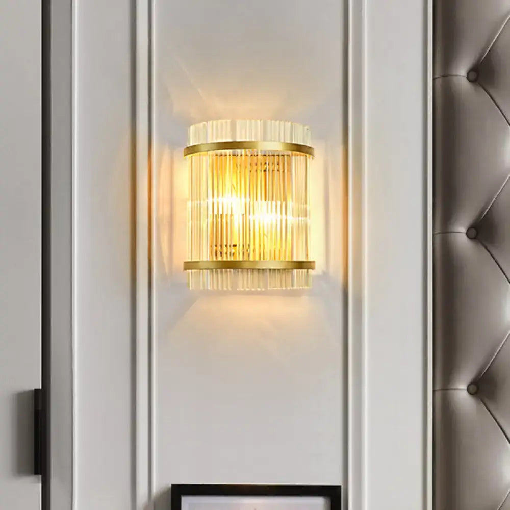Gold ribbed glass wall sconce by Decorbites with brass rings and warm glow on white wall on Tampa Home & Garden Store