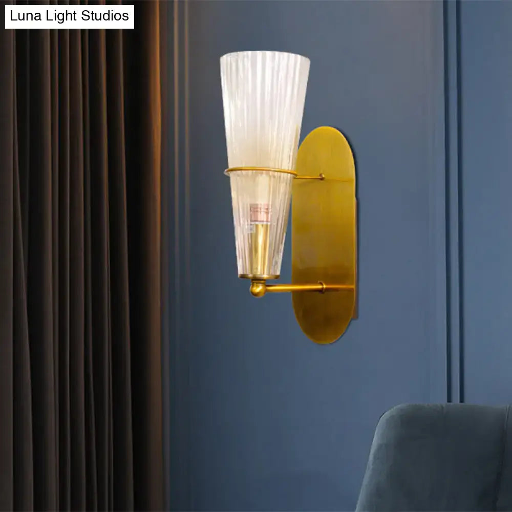 Gold Ribbed Glass Industrial Sconce by Decorbites with gold hardware on blue wall on Tampa Home & Garden Store