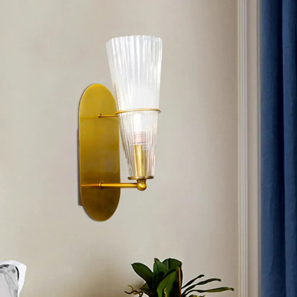 Gold ribbed glass industrial wall sconce with brass backplate and clear shade by Decorbites on Tampa Home & Garden Store